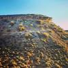 Ledge riding at Deadringer Trail at sunset.