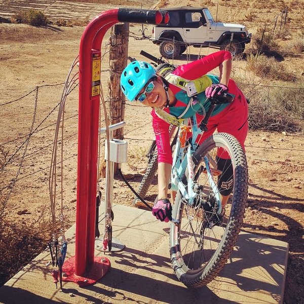 Very bike friendly bike repair stand in the parking lot.