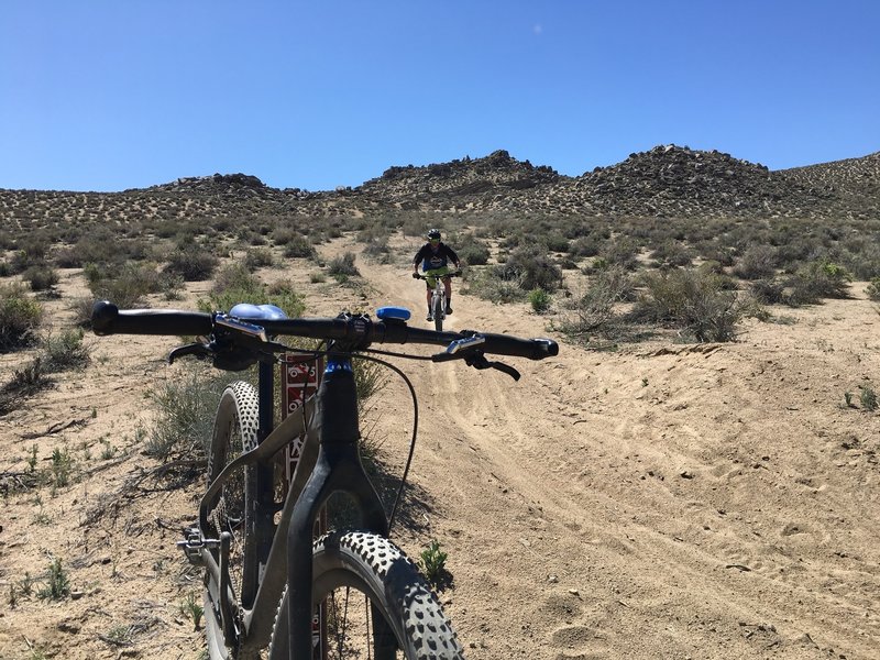 Coming down desert singletrack shared with motos.