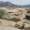 I used to listen to The HooDoo Gurus in high school, and now I'm riding with them. Looking east towards Zion. The greenish mound on the left of the picture is the edge of the cinder cone. Fun ride.