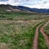 The beginning of Box 'o Rox Trail is doubletrack but will soon change to singletrack. You can see I-70 going up into the mountains in the background.