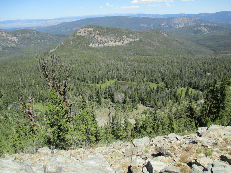 Swift Lake with Bloody Dick Creek drainage on the left and Park Creek on the right. The trail goes through the pass just below the lake.