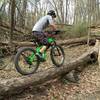 Riding one of the many fun technical features at Lebanon Hills! A great intermediate trail system with some advanced "B" line features you go ride around or challenge your friends on, like this log!