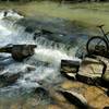 A secluded overlook provides a relaxing view of the shoals above Williams and Owen Forge Dam remnants.