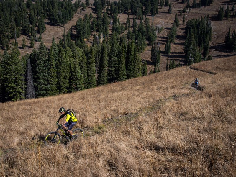 Mitch, manager of Habitat Bike Shop in Driggs, ID and Geordi, owner of Grand Targhee Resort in Alta, WY traverse Action Jackson on their way out to Colter's Escape and Mill Creek.