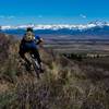 Rider Jake Hawkes get his XC on in the Big Hole Mountains' Lower Horseshoe Canyon network with views of Teton Valley and a snowy Teton Range. Photo: Dana Ramos - Instagram: @dnasince1979