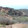 View from the Flying Mane Trail, looking down at where the Fossil Trail meets the Red Tail Trail. The Canyon View Trail is on the right.