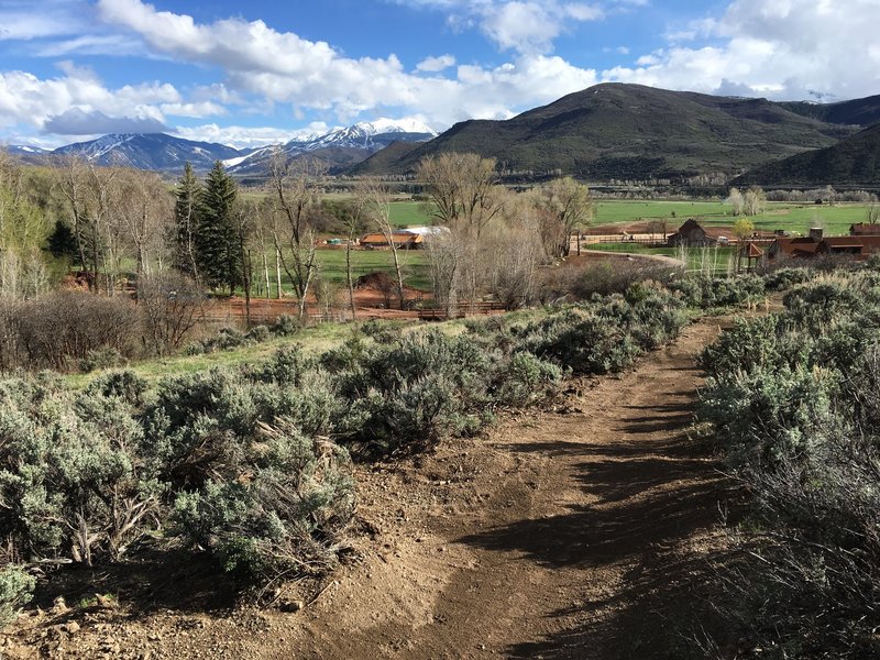 Heading back down the Red Canyon Trail. Aspen Highlands in the distance, Aspen Valley Ranch in the foreground.