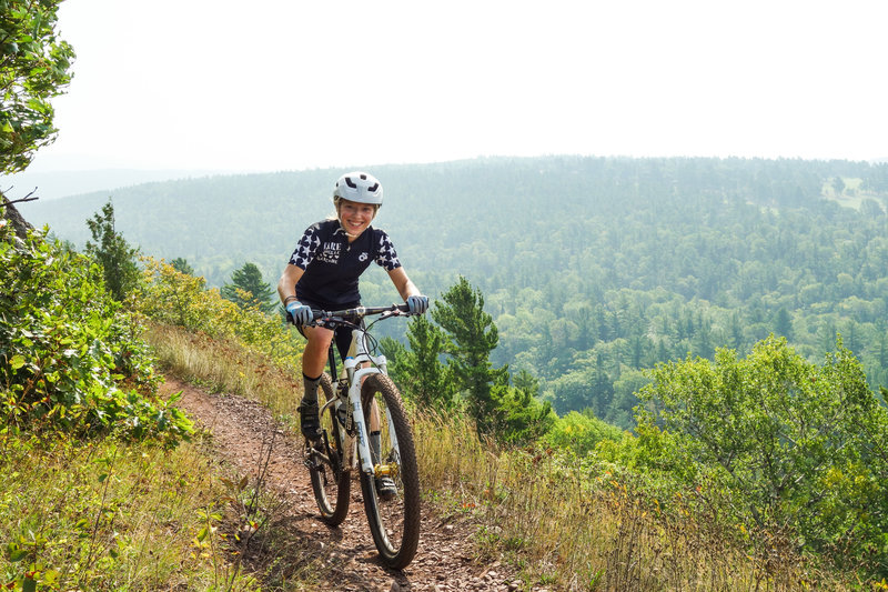 Riding up from the serpentine bridge nearing the roadway overlook at On The Edge Trail