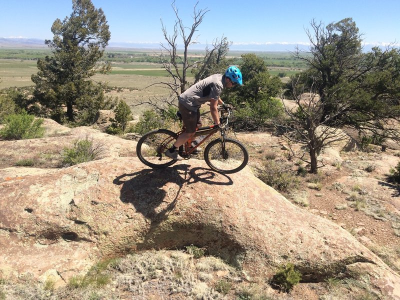 Brink, a key player in developing trails in the SLV, playing on a fun optional spine.