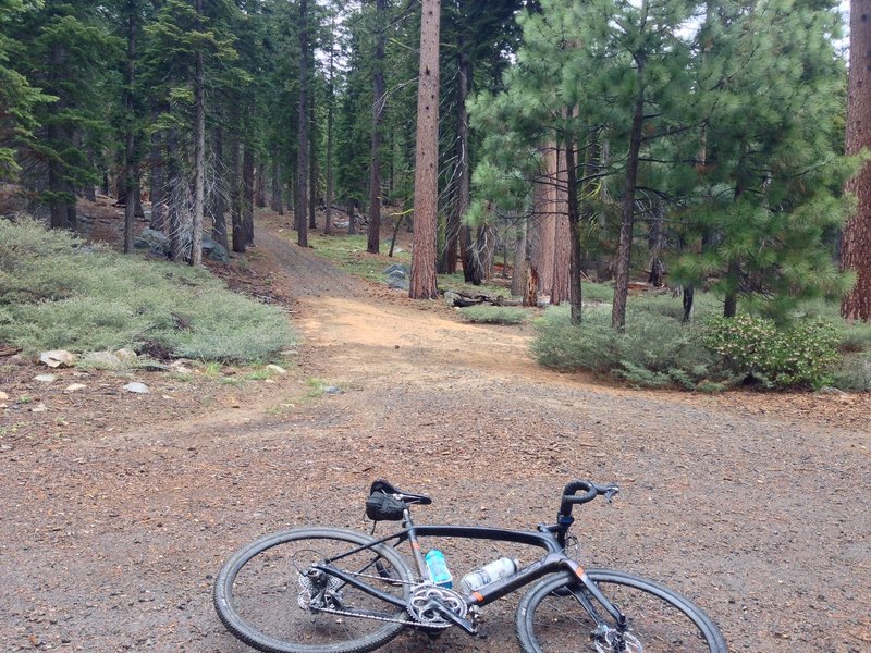 Trail entrance on the south side. A wide open fire road and large intersection with no signage.