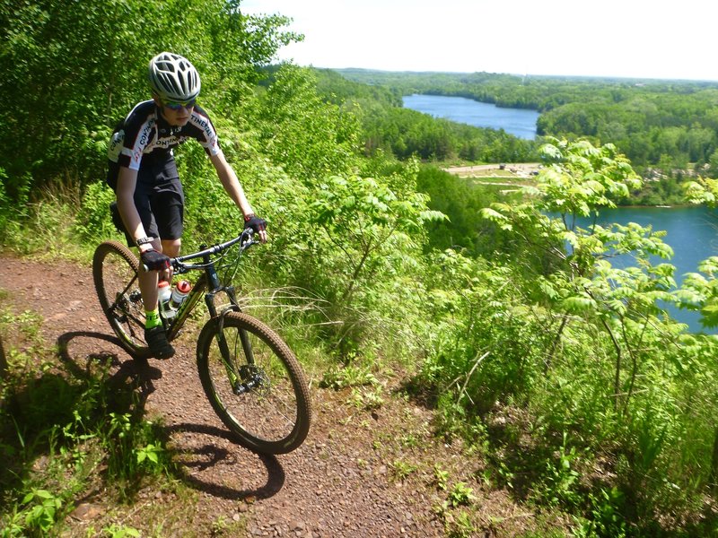 Cresting the climb on Miners Mountain, enjoying the view, ready for a fun descent.