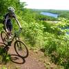 Cresting the climb on Miners Mountain, enjoying the view, ready for a fun descent.