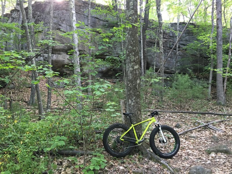 About 3/4 of the way up a pretty steep/aggressive climb, you come to a pretty cool cliff face, the view makes it all worth it.