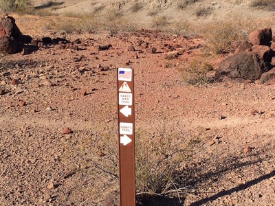 This is the fork in the road sign splitting the two trails. Stay left to hit Naked Man.
