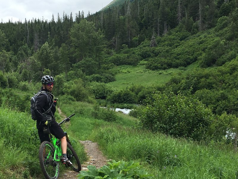 Around 4 miles, I think. Just before entering Bearatithia-really prime bear terrain the last 2 miles to the lake so be loud!