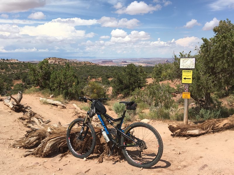 Getaway now begins near the intersection of UT313 and Gemini Bridges rd. Monitor,  Merimac and the Courthouse area distant.