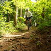 A steep downhill that goes to the disc course parking lot.