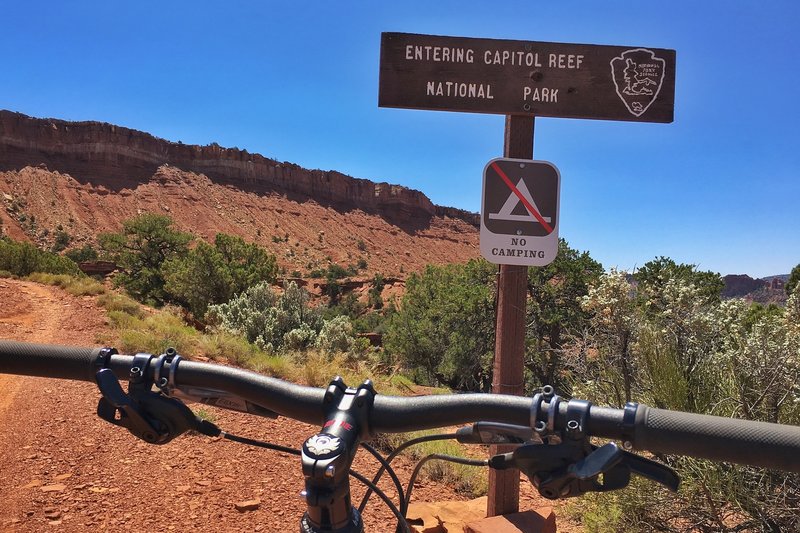 Entering the park on bike.