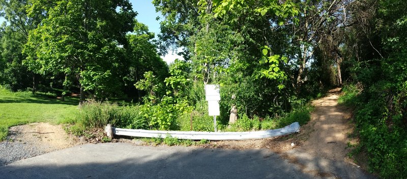 The trail meets in one spot a dead end road.