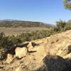 The Pick maneuvers between large boulder as you traverse along.