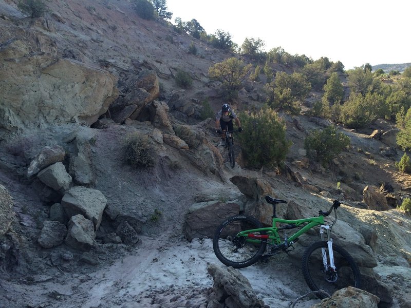 Bruce up and over a rock feature.