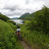 Biking along summit lake on the Johnson Pass Trail.