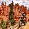 Susan B rolling through the Hoodoos near Bryce. Behind the camera is Zach B.