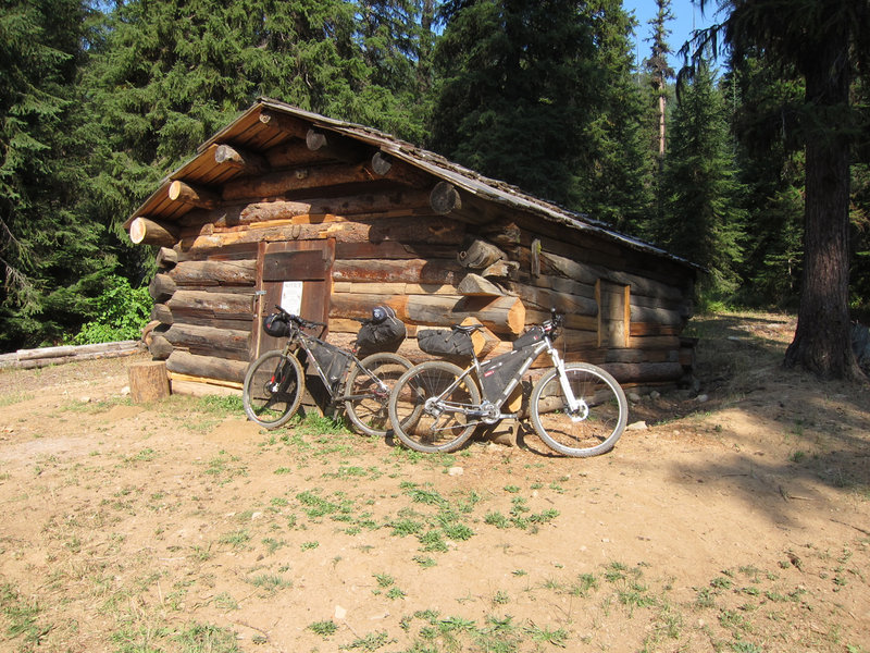 Greenwood Cabin at 6 miles. The cabin is locked but there is a large established camping area here.
