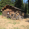 Greenwood Cabin at 6 miles. The cabin is locked but there is a large established camping area here.