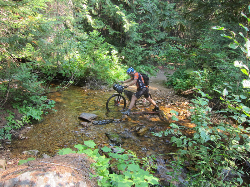 Crossing a creek on the North Fork Fish Creek Trail.