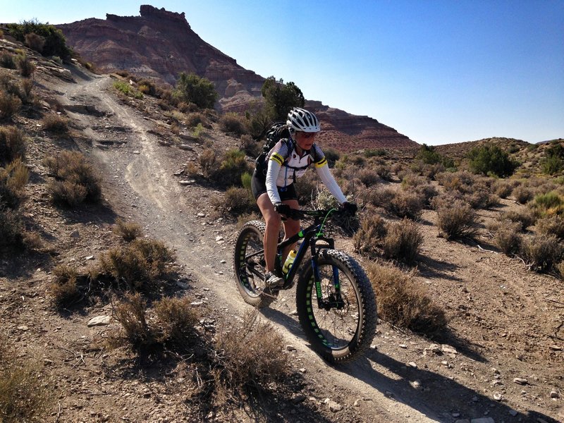 Susan Bryan dropping in with the 4.6 fatty tires at the JEM trail Utah.