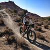 Susan Bryan dropping in with the 4.6 fatty tires at the JEM trail Utah.