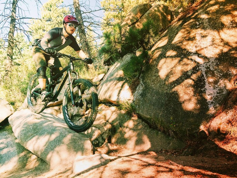 Fun features and tight switchbacks on the east side of Sisters Trail.