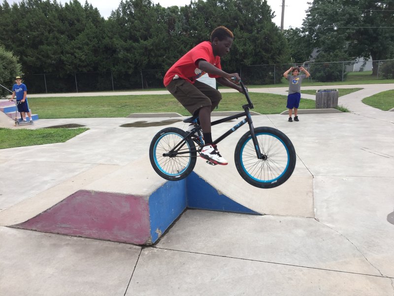 Catching some air at the skate park! He got a MTBProject sticker and a request to get a helmet too.