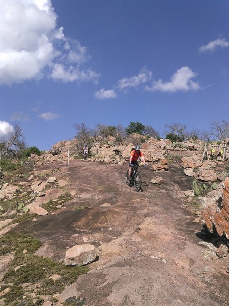 Riding down the slick granite rock on the Epic Trail below Decision Point.