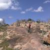 Riding down the slick granite rock on the Epic Trail below Decision Point.