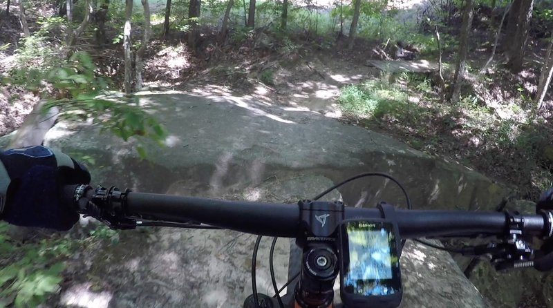 Boulder hopping before crossing a bridge.