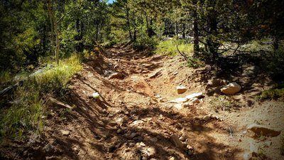 The trail feels like riding down a dry river bed - lots of sand, loose scree and boulders.