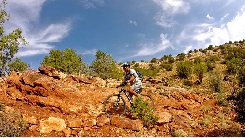 Dropping into the canyon takes you through beautiful red rock formations.