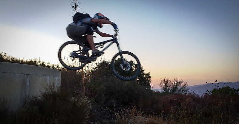 Dropping off the water tank at sunset, on the singletrack connector.