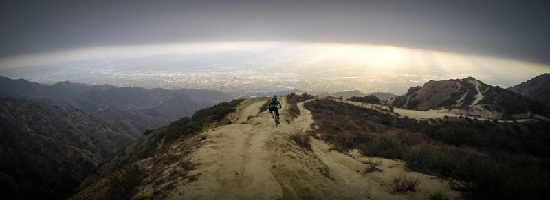 Riding the ridge, just under the cloud cover.