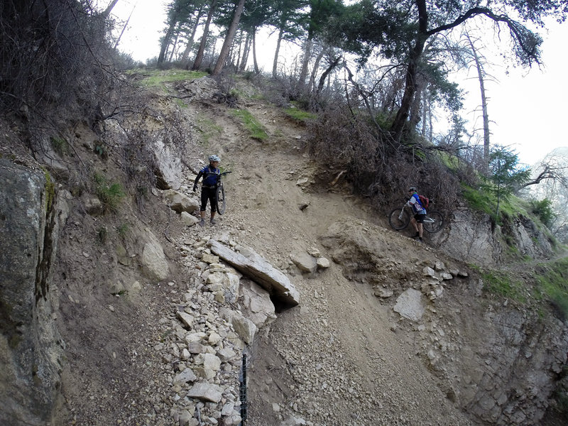 Traversing one of the slides that can happen on this trail after heavy rains.