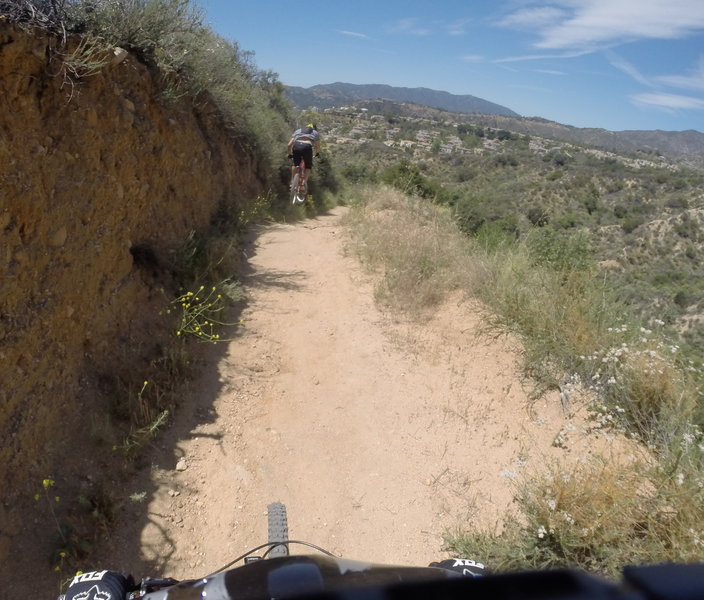 Putting some of the natural trail features to good use, on the lower section of the trail.