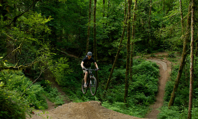 Getting a little air off an optional step-up on Ryan's Line at Duthie Hill Park, WA.