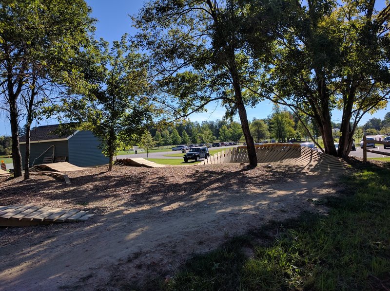 Skills Park at Huffman entrance. Wood berm into table tops.