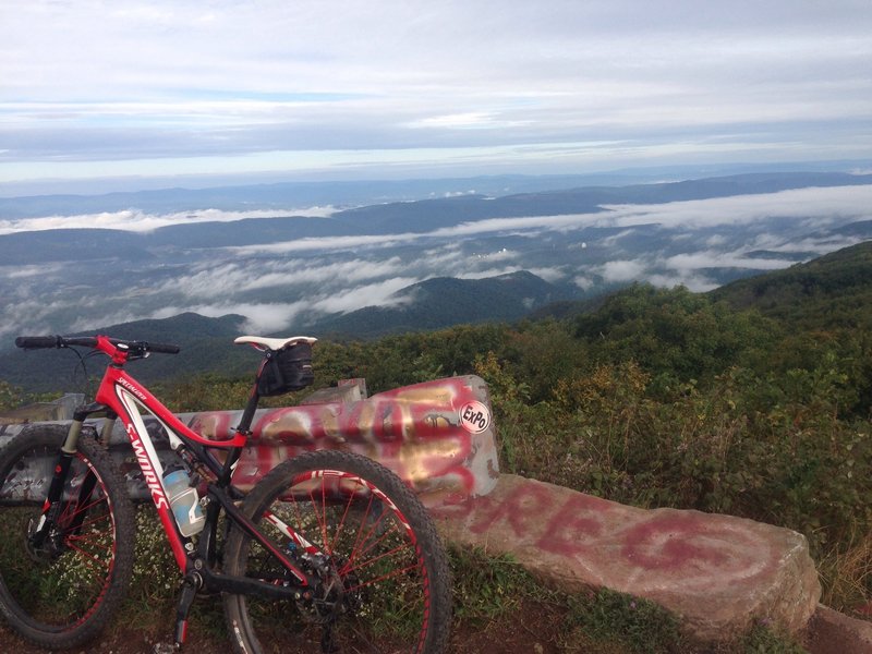 View from Reddish Knob. The rock to the right of the bike is the top of Timber Ridge Trail.