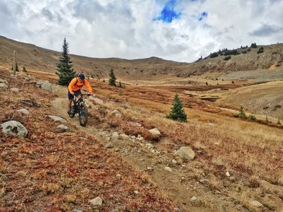 Greg D. showing off his moto brake lever style on Canyon Creek while descending out of the alpine.