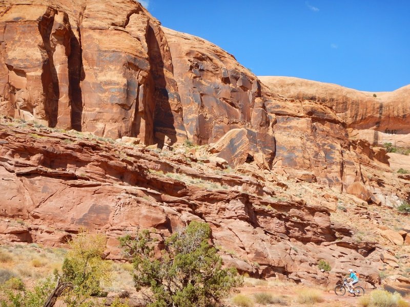 You feel pretty small among the cliff features. What a pretty spot to ride your bike!