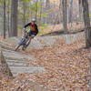 Berm feature on Hampton Hills Intermediate Trail heading downhill towards Woodward Creek.